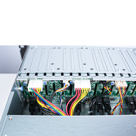 Close-up of drive backplane with power and data cables.