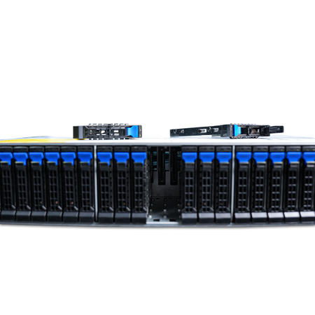 Close-up of server front with two empty 2.5-inch drive bays and the removed drive trays resting on top.