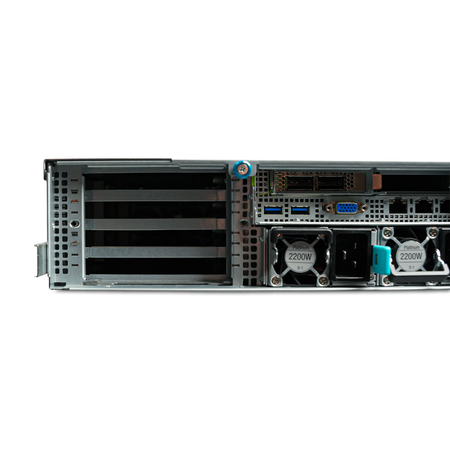 Left rear close-up of server PCIe slots, I/O ports, and dual 2200W power supplies.