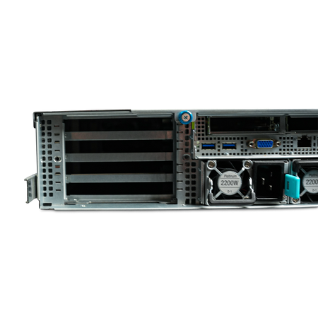 Left rear close-up of server PCIe slots, I/O ports, and dual 2200W power supplies.