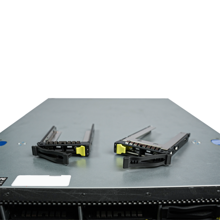 1U rack server, close-up of two removed 2.5-inch drive trays resting on top cover, low front angle