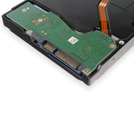 Underside of a Seagate enterprise hard drive featuring a green PCB with gold-plated SATA data and power connectors, set against a black metal chassis.