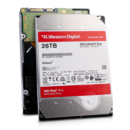 Two Western Digital WD Red Pro 26TB NAS hard drives (model WD260KFGX), one showing the top label in front and one showing the circuit-board underside behind.